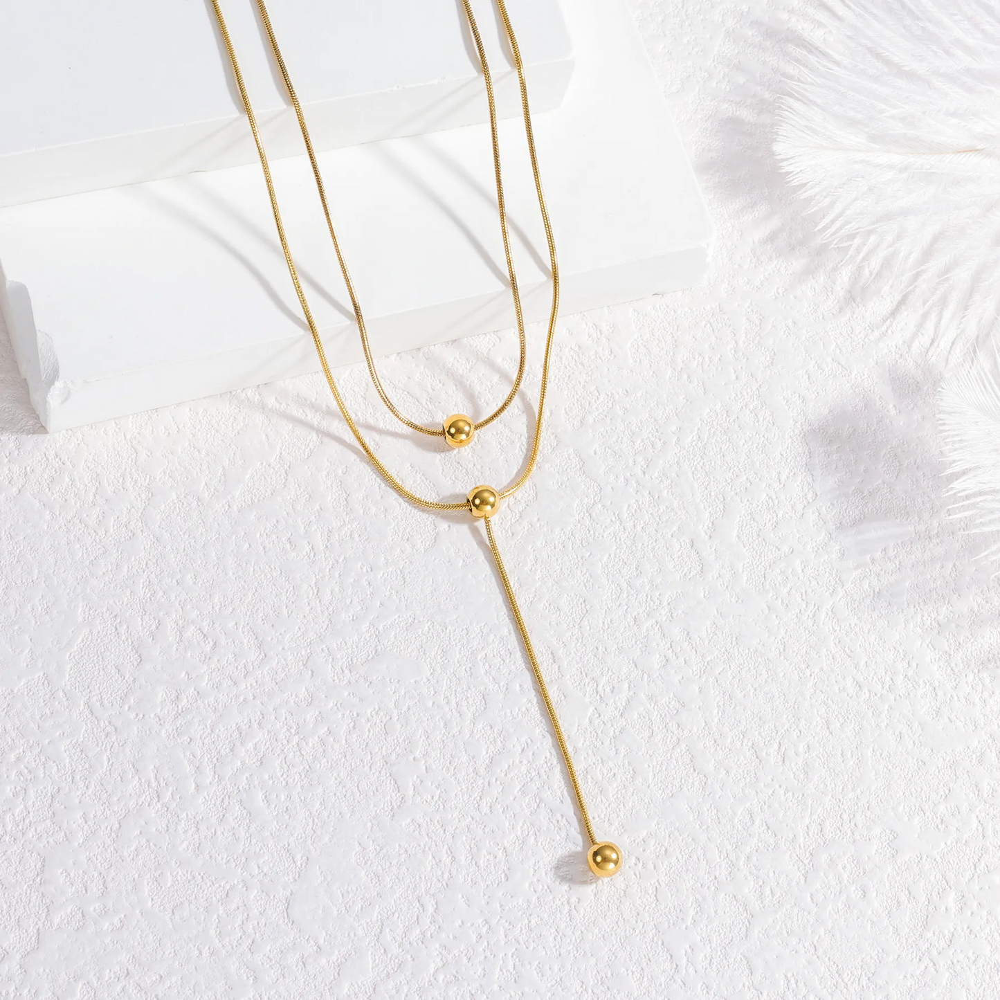 Corbatero doble capa con esferas