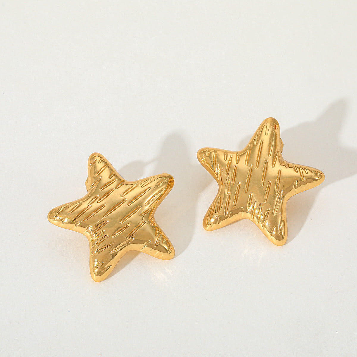 Aretes estrella rayada