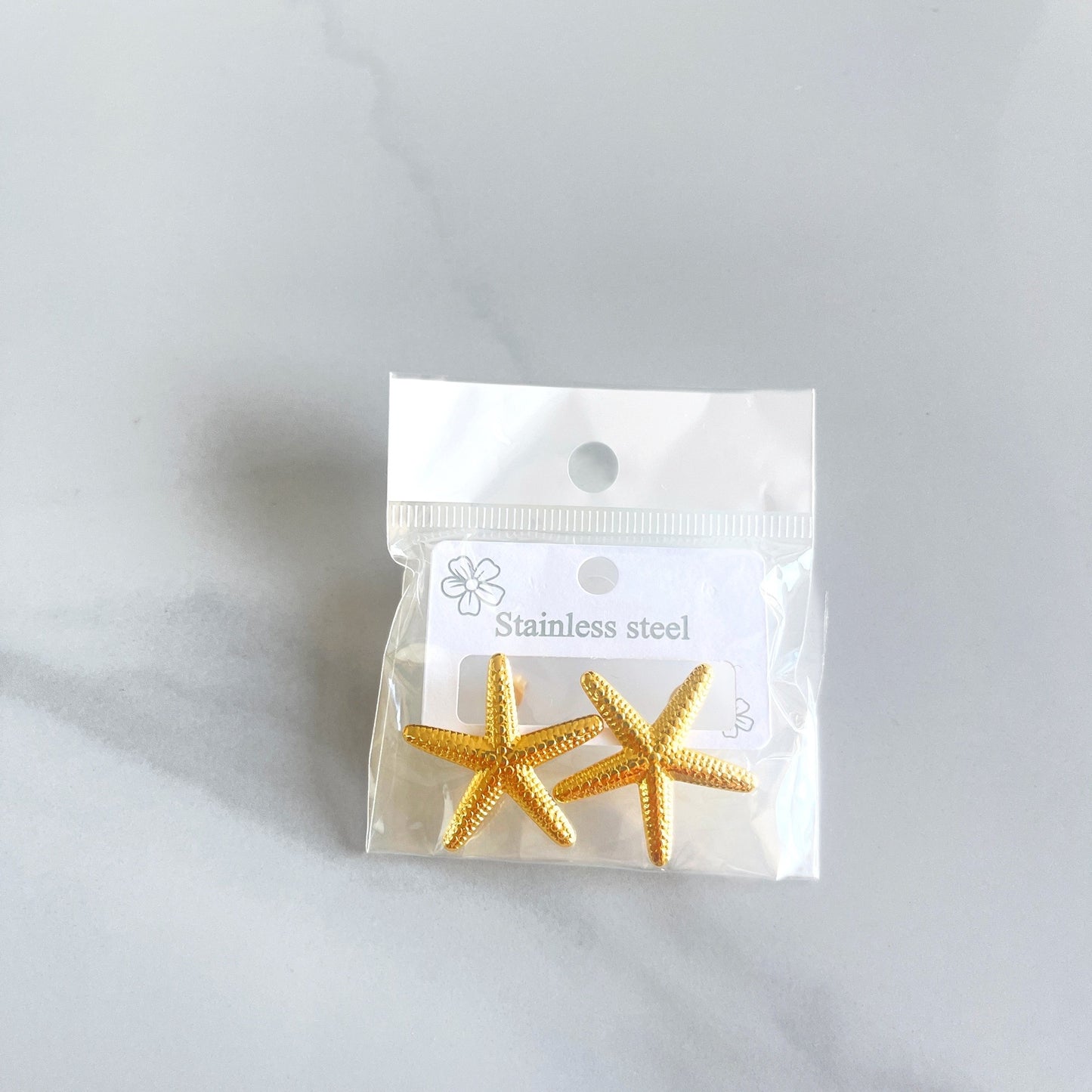 Aretes estrella con textura recta