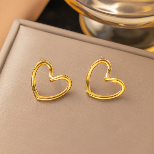 Aretes corazón contorno dorado