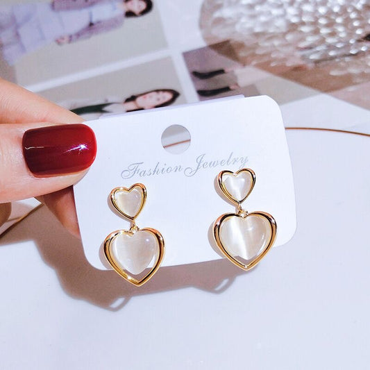 Aretes doble corazón coquete