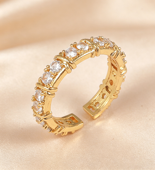 Anillo churumbela dorado con x