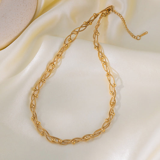 Collar trenzado de bolitas en dorado