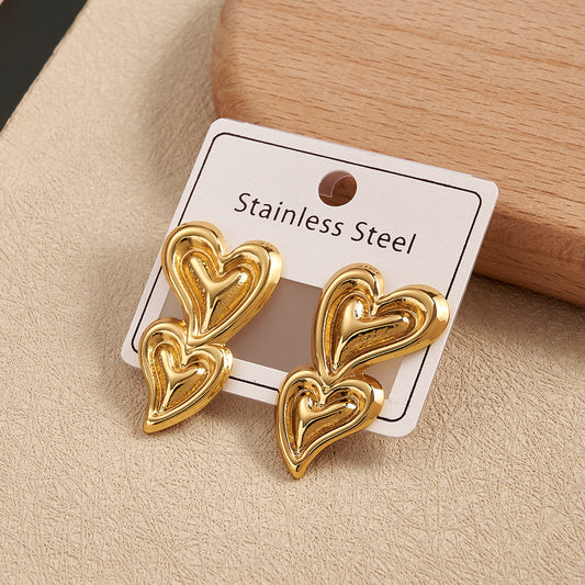 Aretes doble corazón con onda