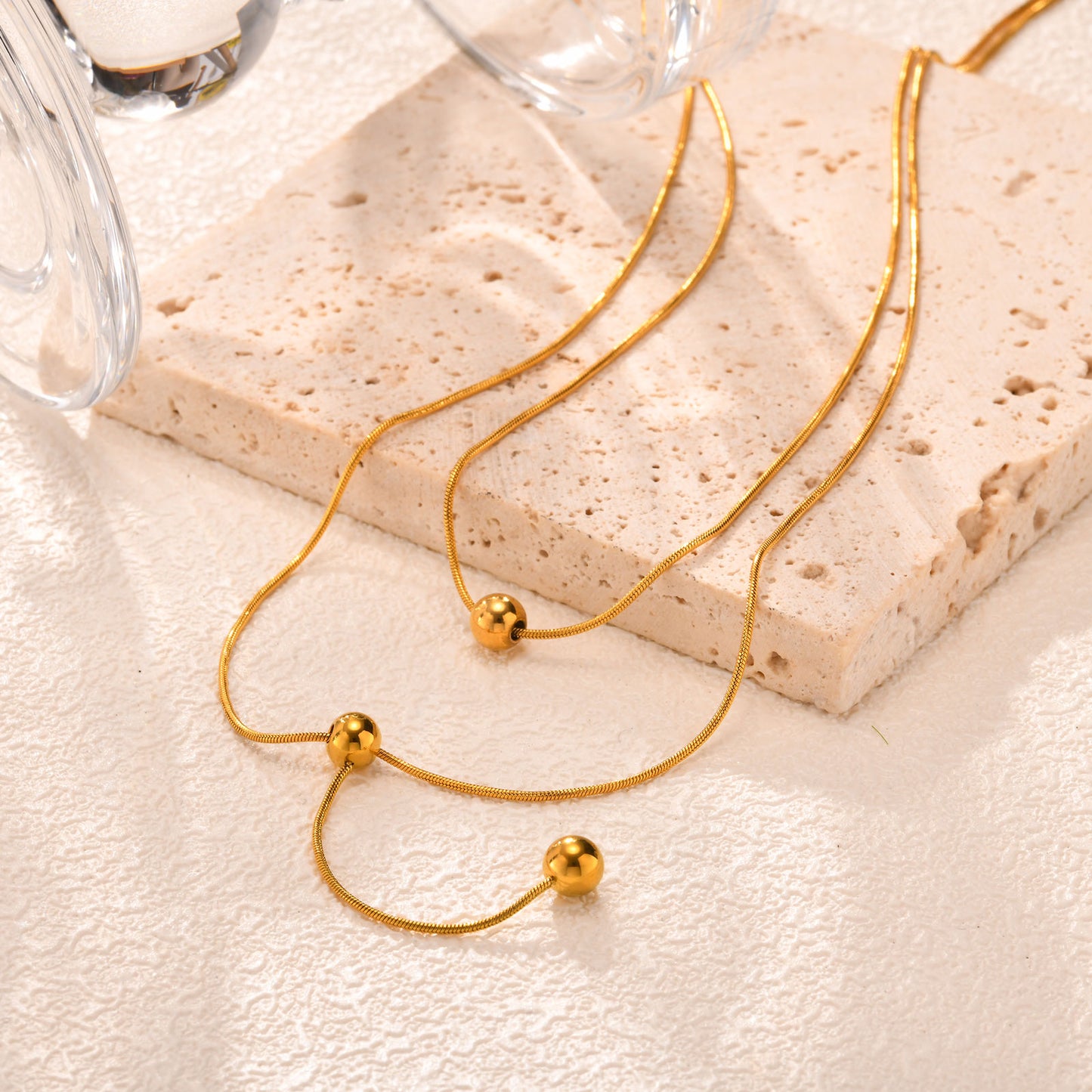 Corbatero doble capa con esferas