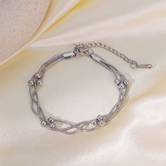Pulsera enredada de esfera plata