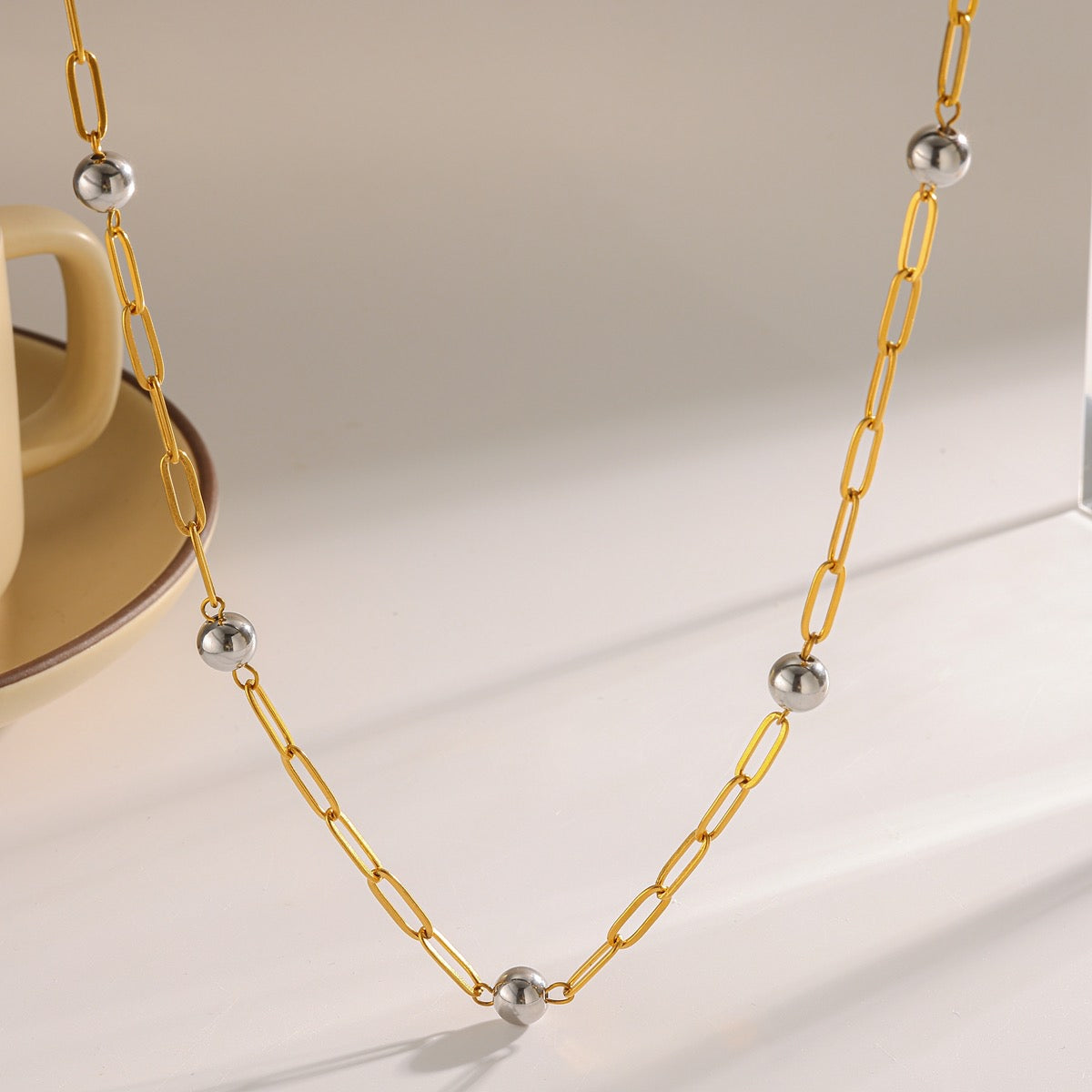 Collar bitono eslabon dorado