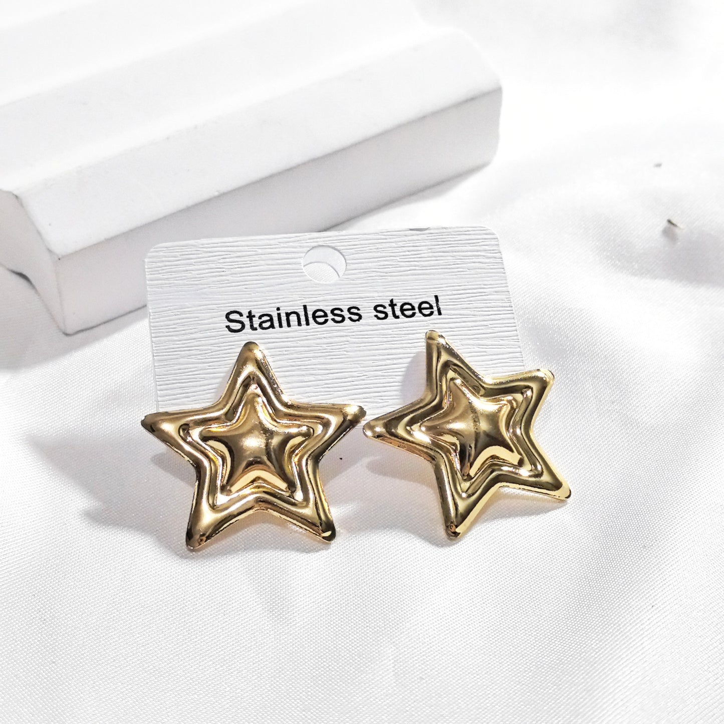 Aretes estrella dorada