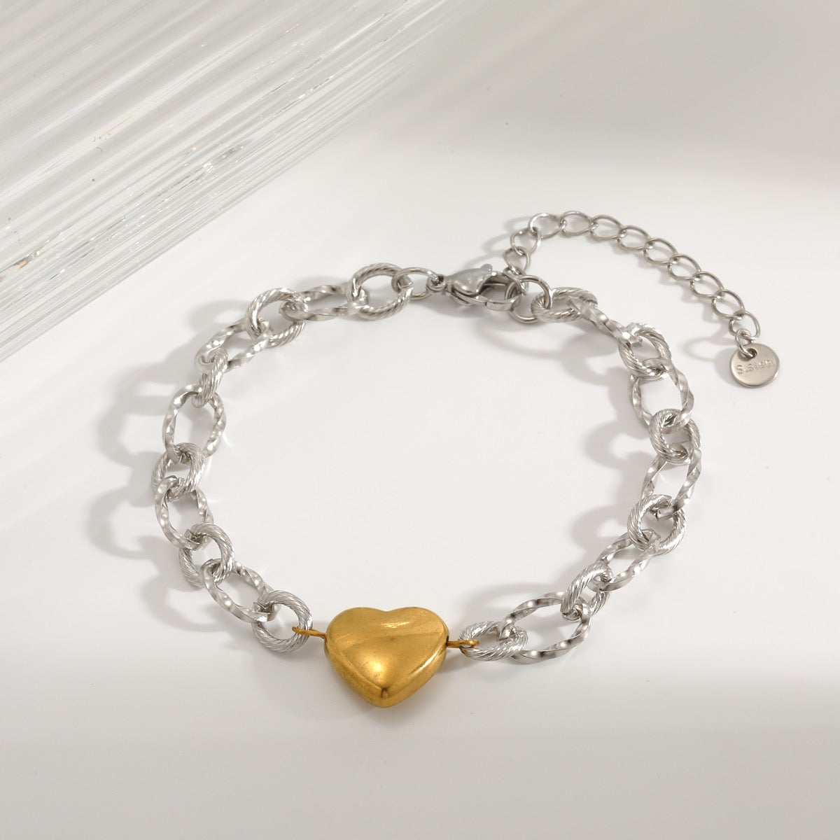 Pulsera eslabón plata con corazon dorado