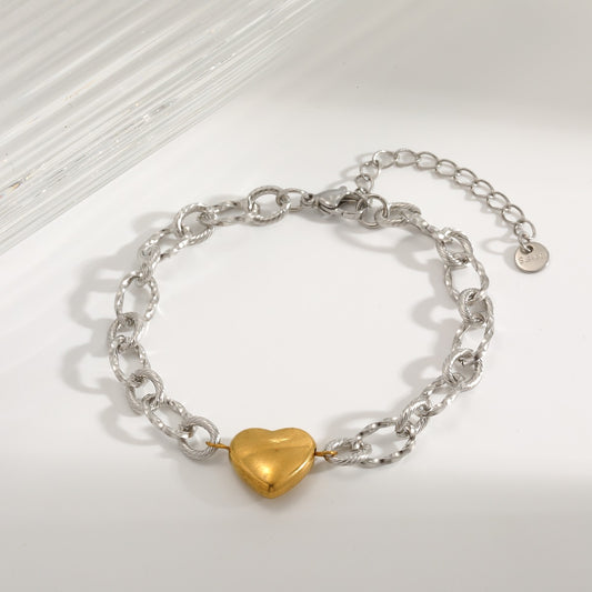 Pulsera eslabón plata con corazon dorado