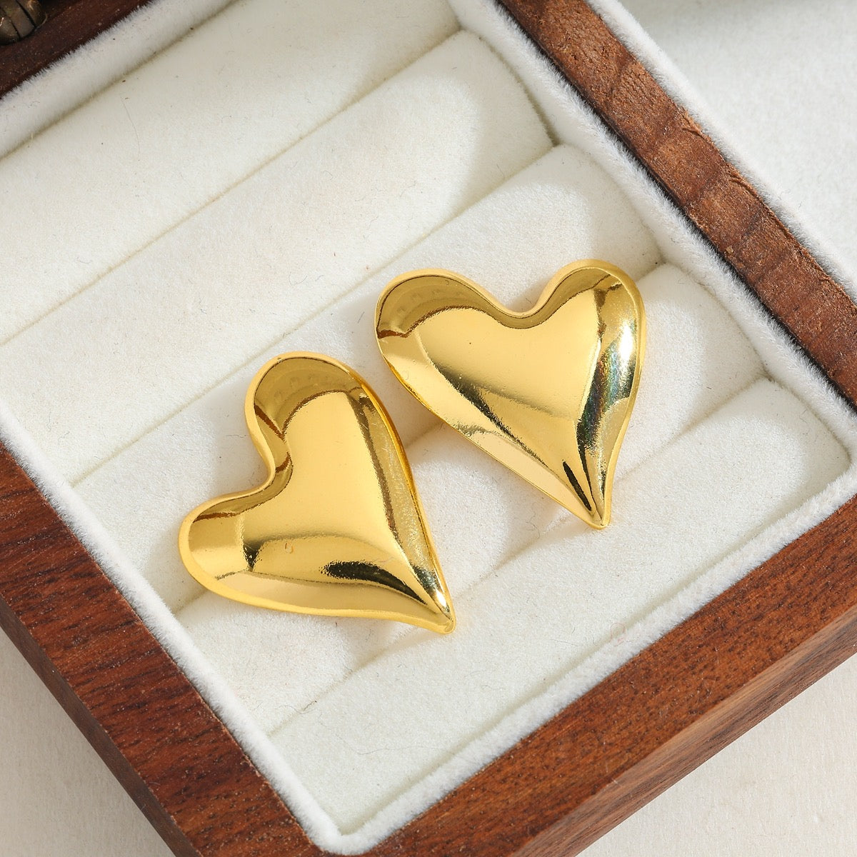 Aretes gordito semi irregular brillo
