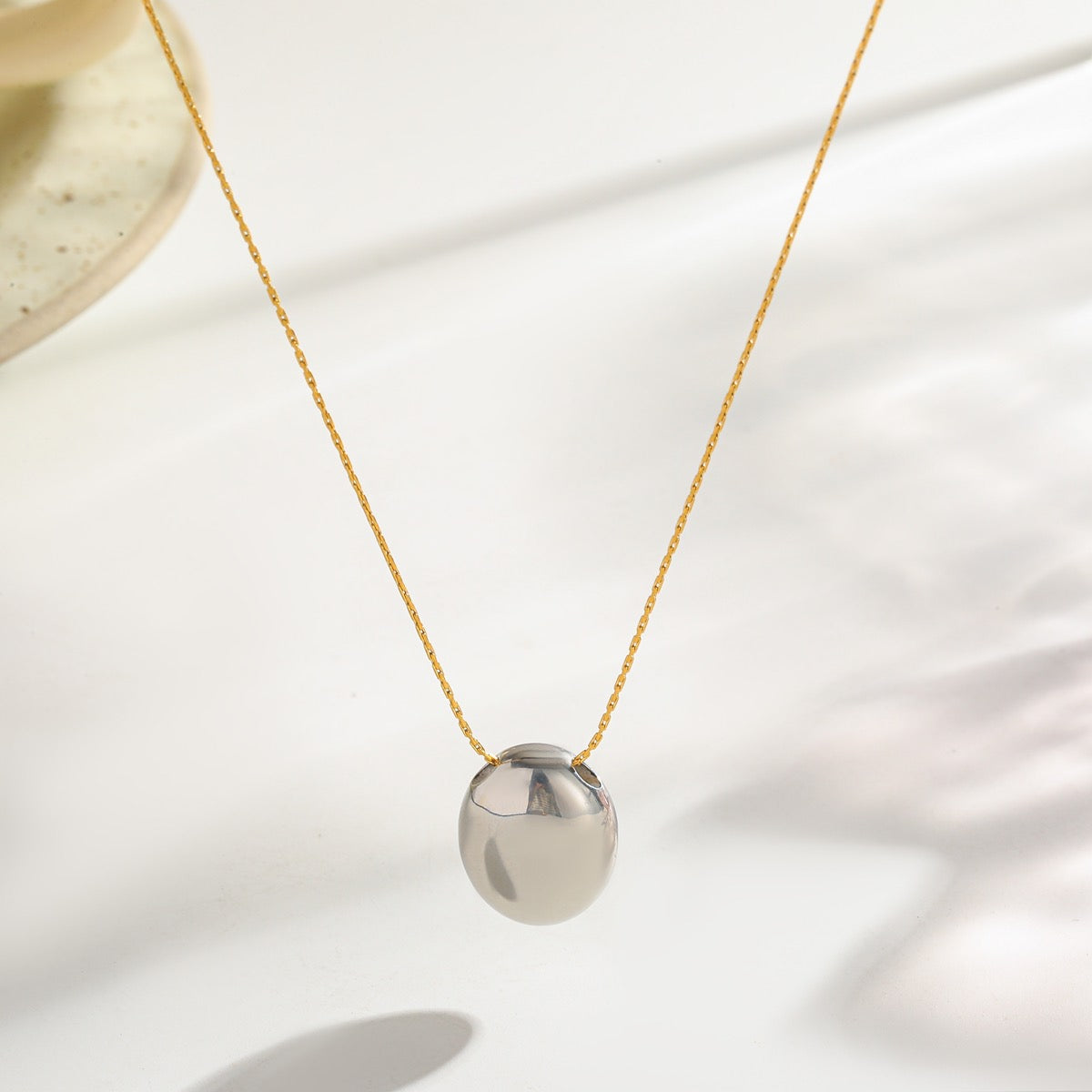 Collar óvalo bitono brilloso