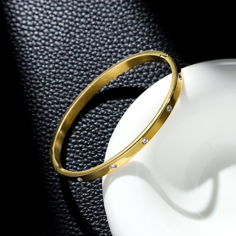 Pulsera Cartier delgada brillo dorada